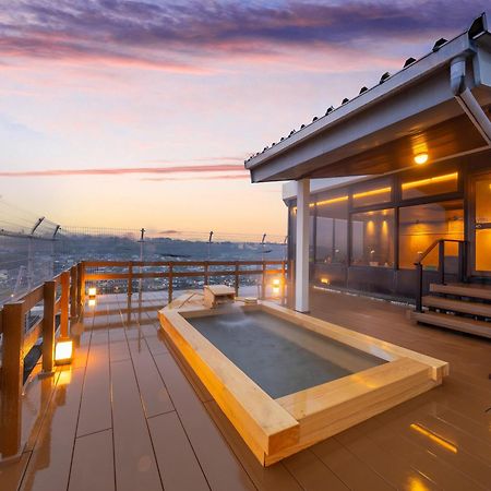 Mikuma Hotel Hita Bagian luar foto